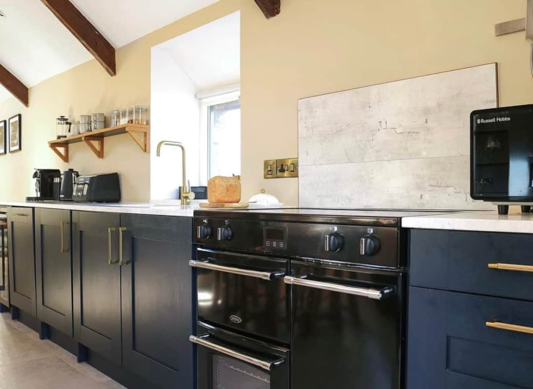 Fully furnished kitchen bathed in natural light, featuring a large electric range cooker with induction hob, washing machine/tumble drier, microwave, toaster, kettle and Nespresso coffee pod machine ( classic citiz capsules not included).