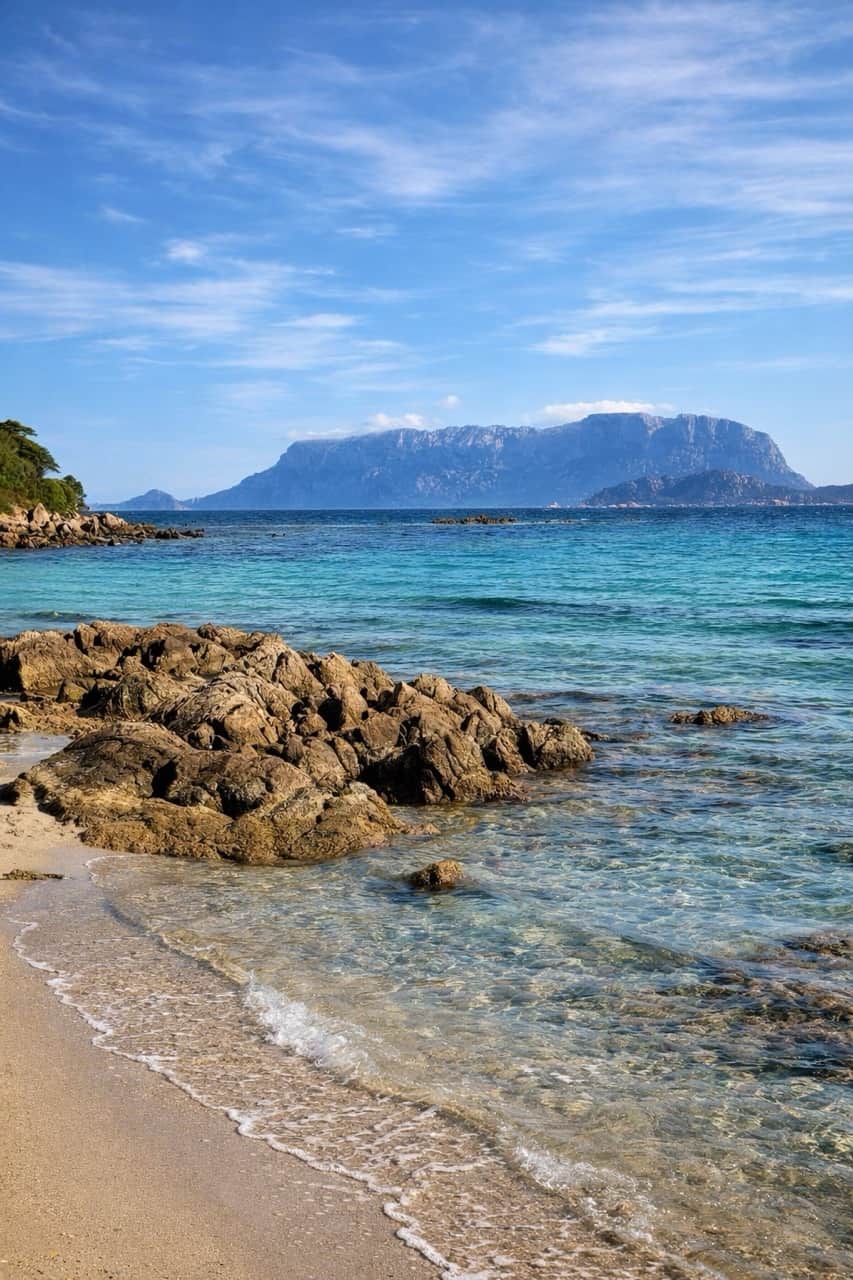Pittulongu Bay sunset over Tavolara island, north-east Sardinia coastline