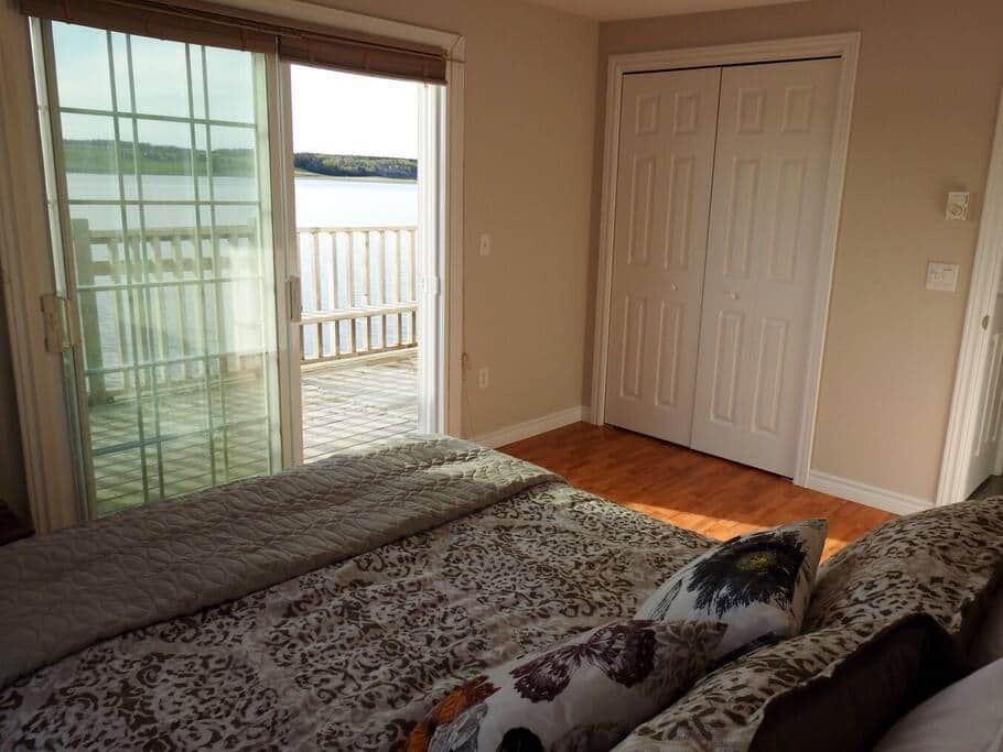 Bedroom with king bed and walk-out to deck Bedroom with king bed and walk-out to deck