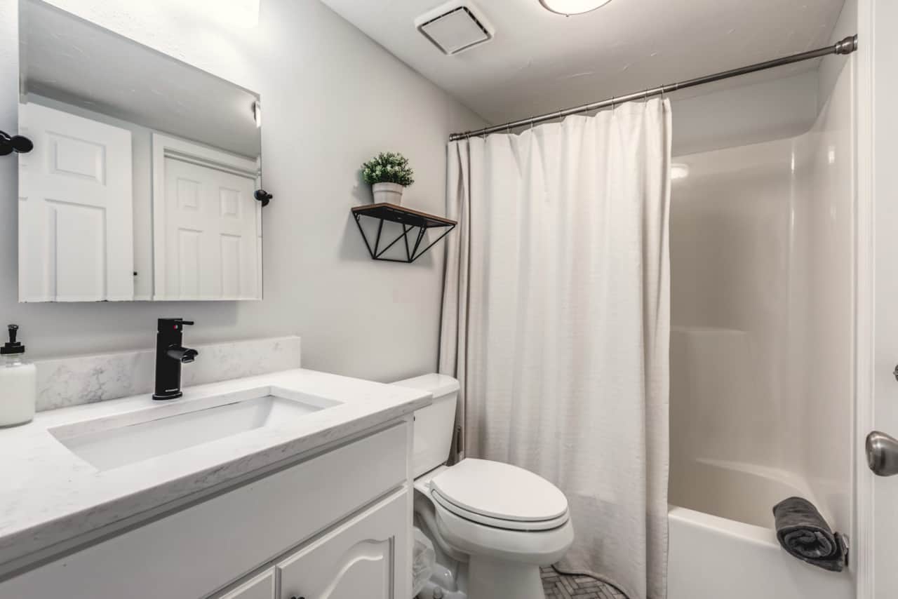 First floor full bathroom with tub/shower combo. 