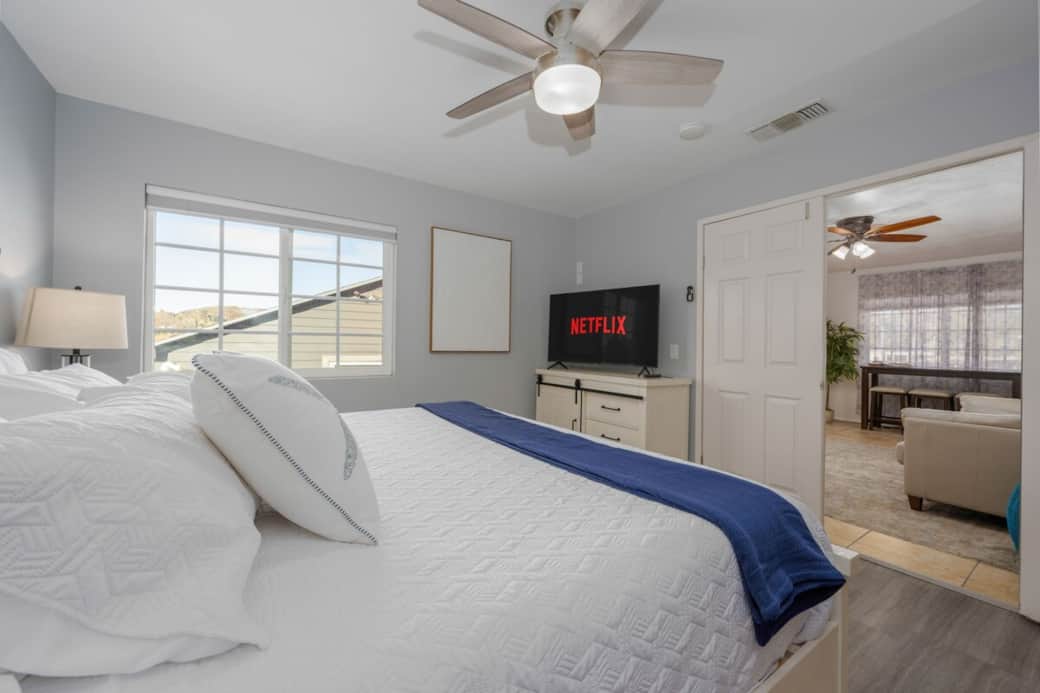 This inviting master bedroom feels like a peaceful retreat, with soft lighting and a cozy atmosphere that opens up to the rear living area, where a comfortable sofa sleeper. A connecting lockable door leads directly into Bedroom 3. This inviting master bedroom feels like a peaceful retreat, with soft lighting and a cozy atmosphere that opens up to the rear living area, where a comfortable sofa sleeper. A connecting lockable door leads directly into Bedroom 3.