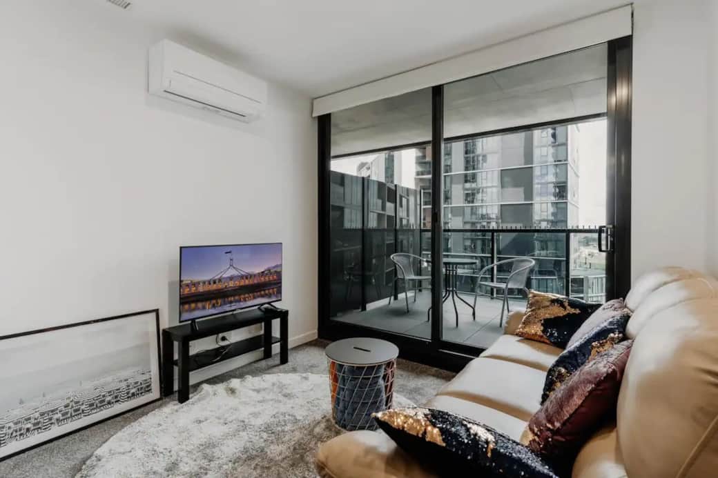Our living room is the heart of the home, featuring a comfortable sofa and a flat-screen TV. The large windows and balcony access let in plenty of natural light, making it a great place to unwind. This room is designed to provide a cozy  atmosphere.