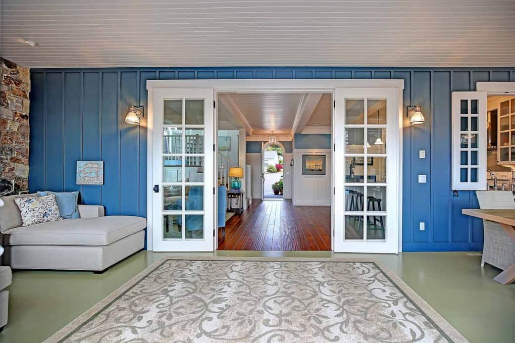 The sun room is where we honestly spend most of our time when we're not outdoors. It has easy access to the pool deck and to the kitchen, and is heated by a gas fireplace.