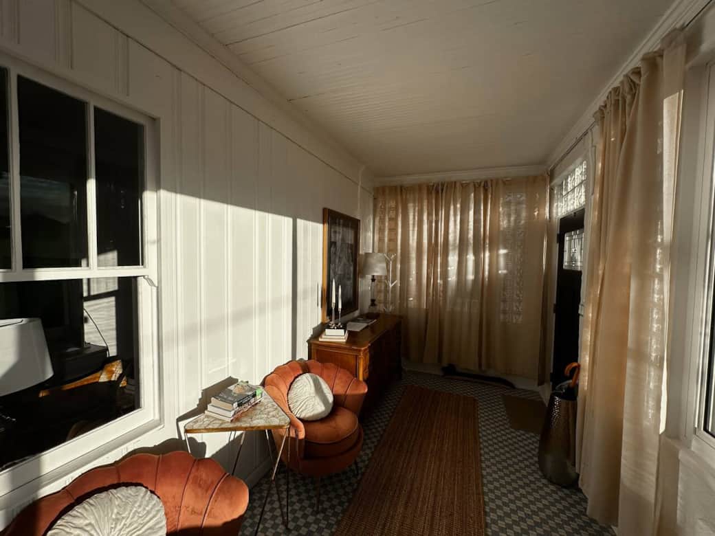 If you prefer your sunlight with a side of privacy, you can close off the windows with curtains that move around the room on a track.