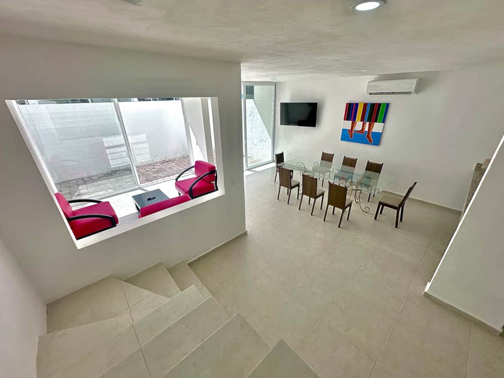 Open living space: living room, kitchen, dining area and patio 