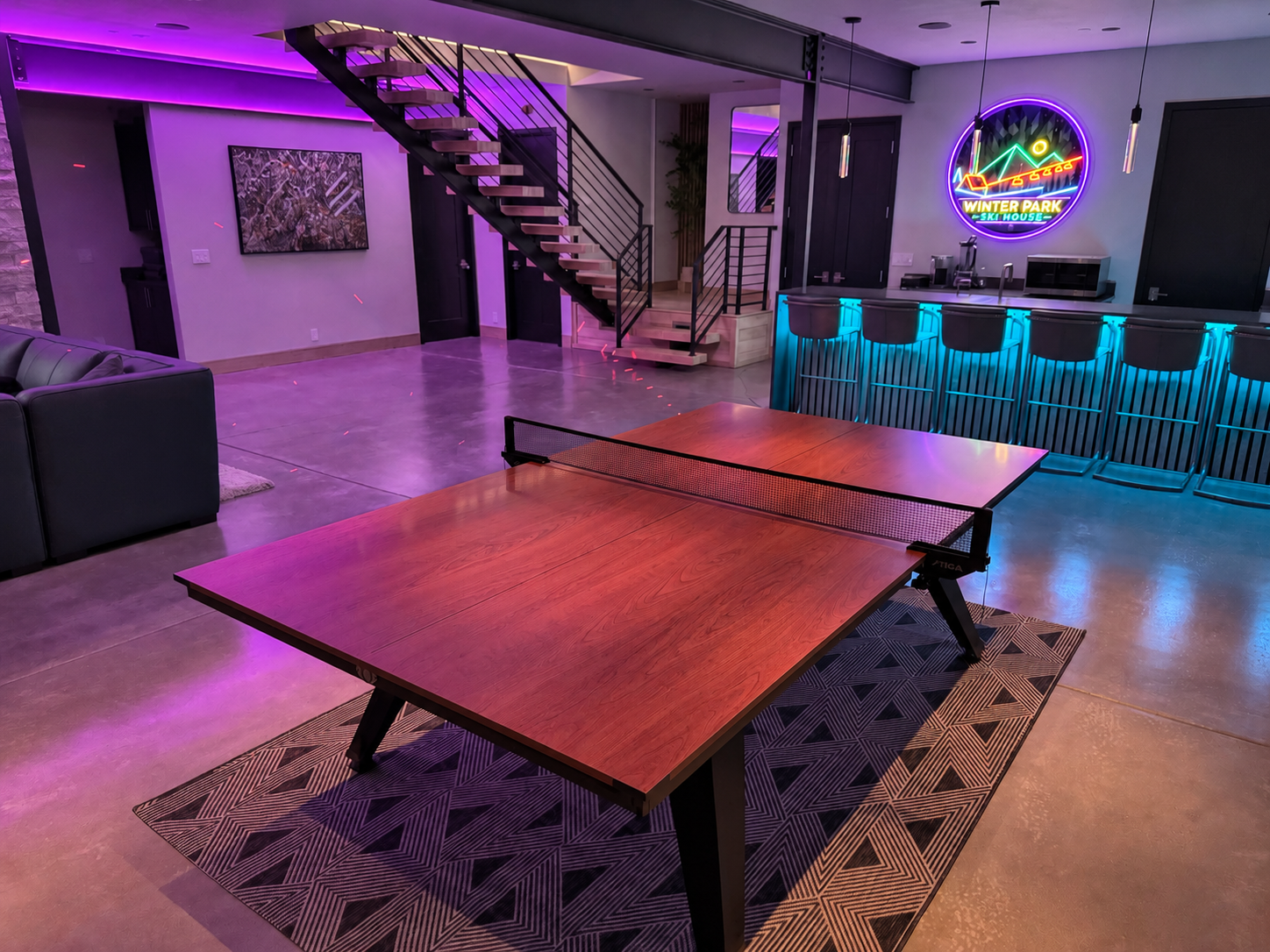 Ping-pong and colorful lights in the lower-level game area.
