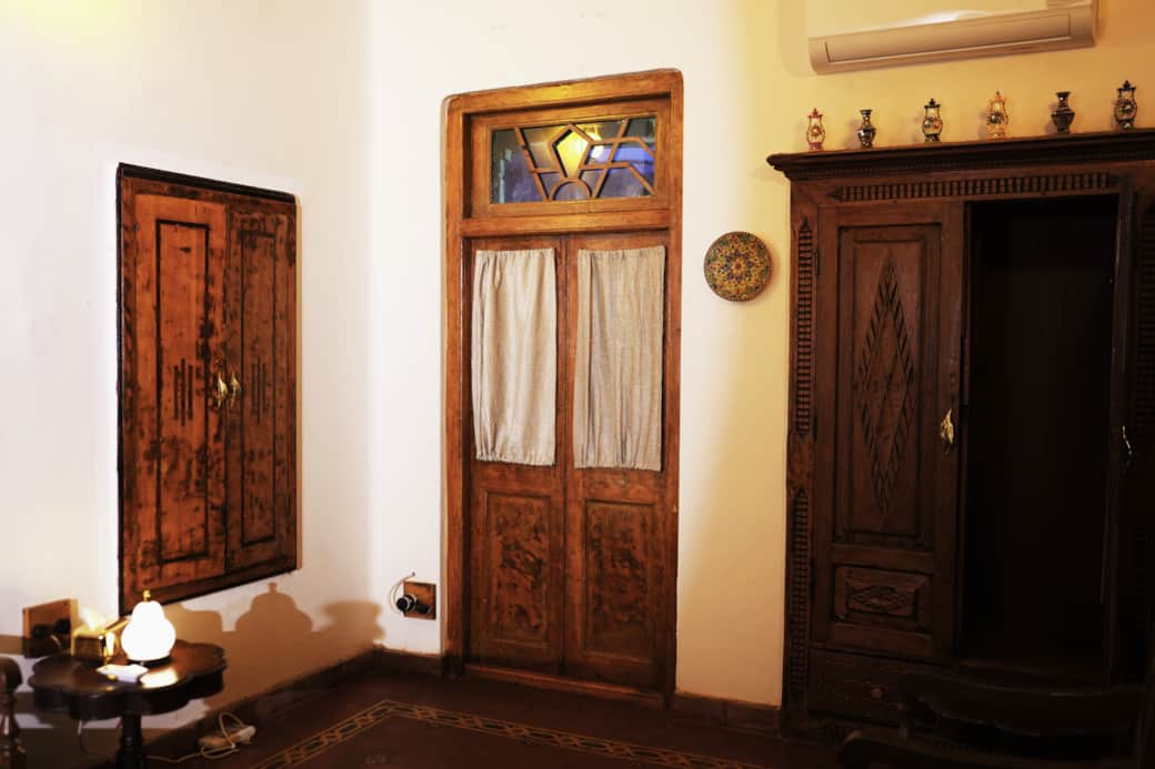 Rustic doors and cabinets bring timeless charm to Saaya