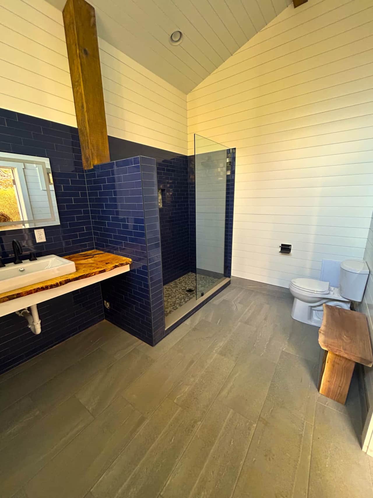 Two rooms, each with sink shower and toilet