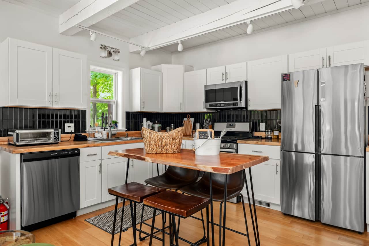 Enjoy the fully stocked, modern kitchen with a gas stove.
