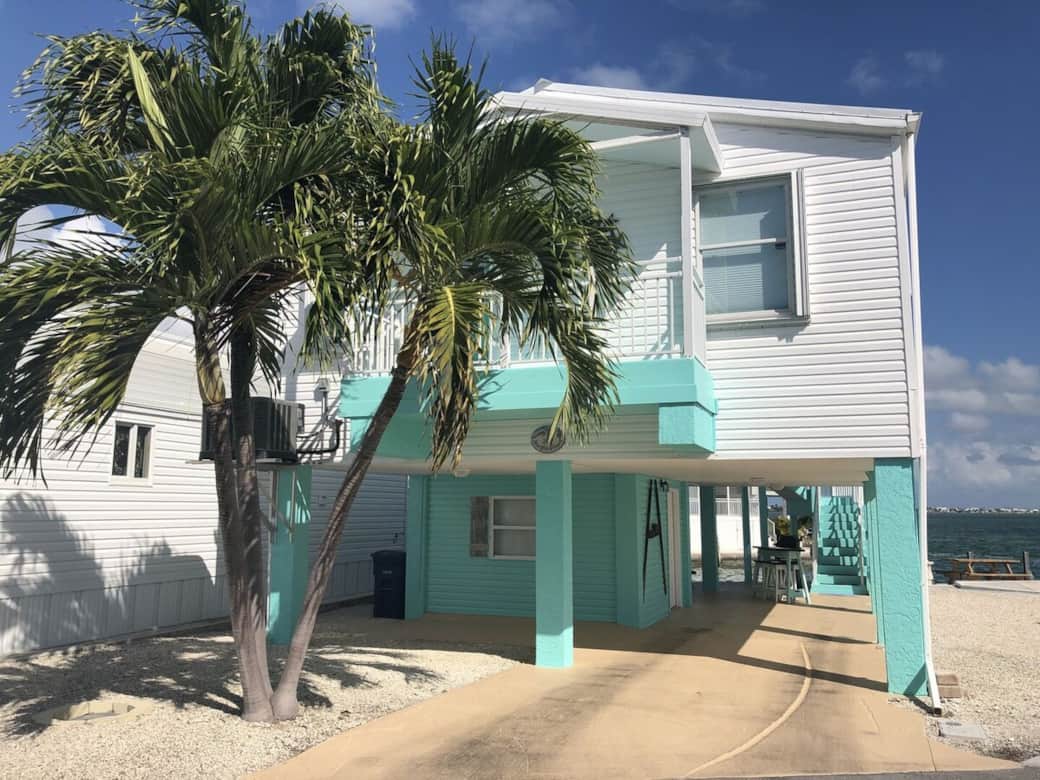 The front of our 2 BR, 2 BA Slice of Paradise that sleeps up to 6. Updated and ready for your enjoyment. Park up to 1 car under the building with up to 83" clearance.  Please call Venture Out to arrange parking for one additional vehicle or trailer.