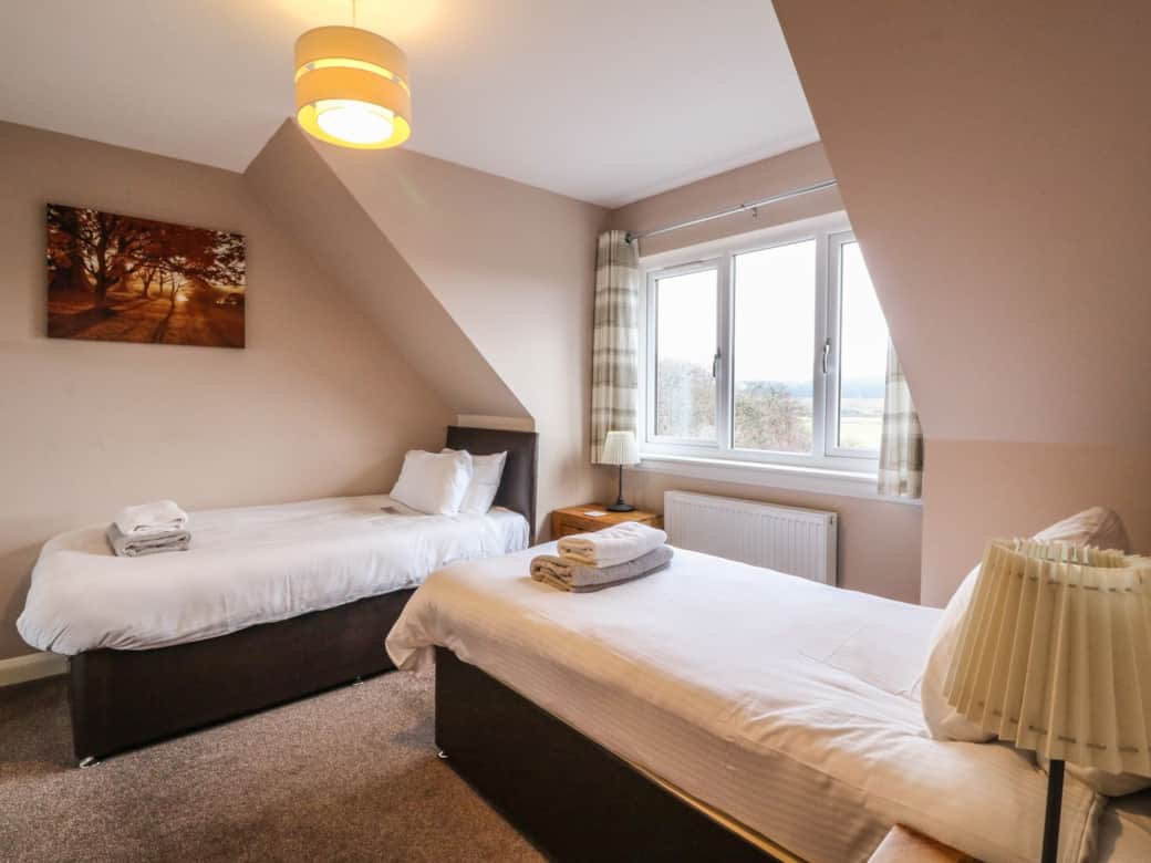 Bedroom 5, twin beds and mountain views