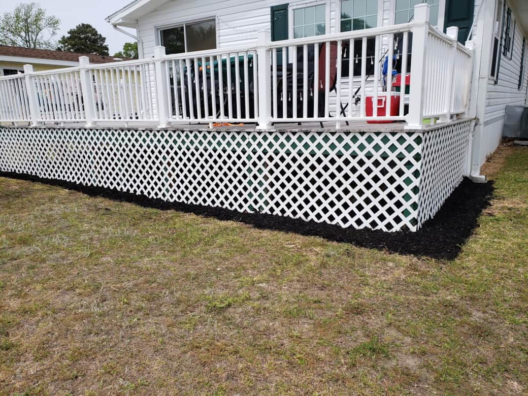 10 foot wide deck with table and chairs which faces the beautiful pond and fountain 