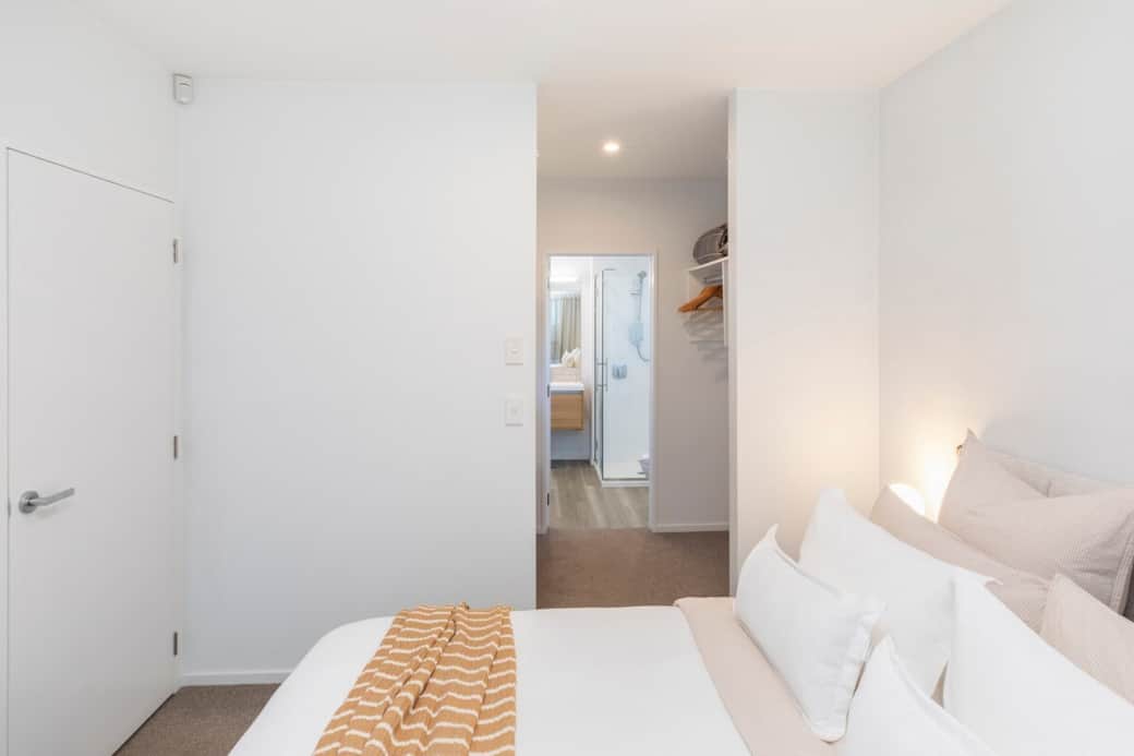 Ground floor king bedroom with walk in wardrobe and private ensuite.