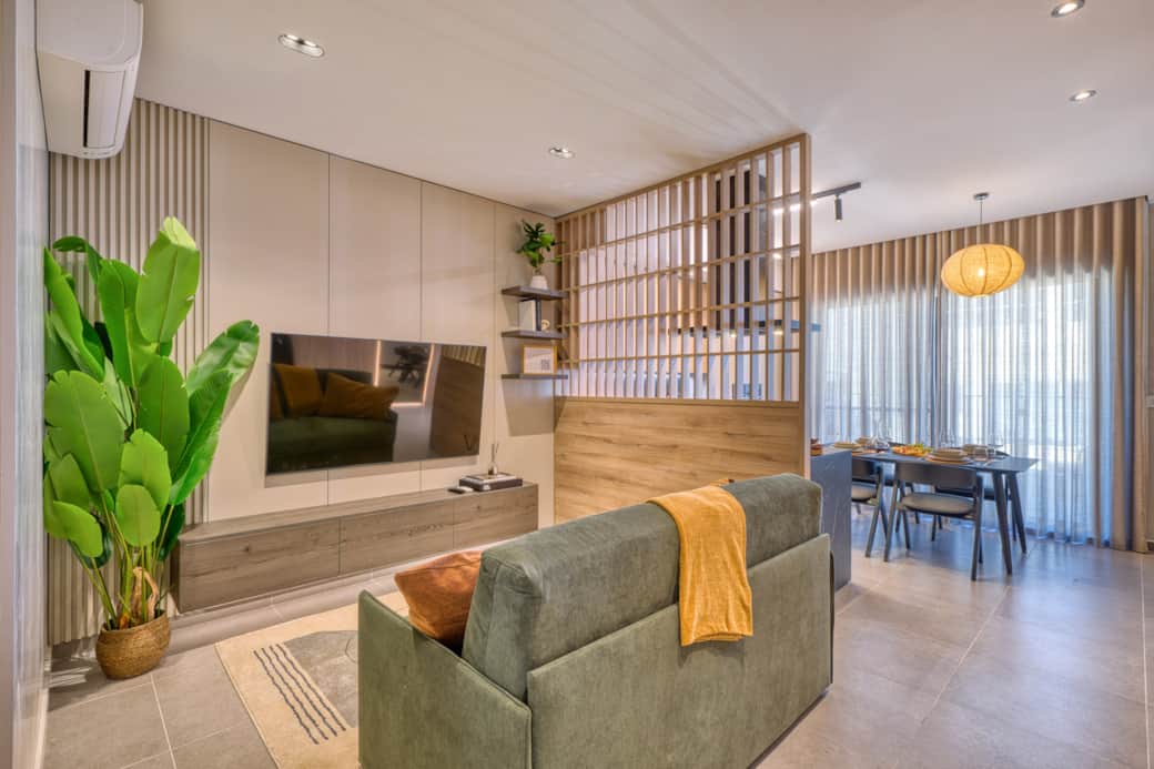 Living area with a designer partition, combining Japanese and tropical elements. Living area with a designer partition, combining Japanese and tropical elements.