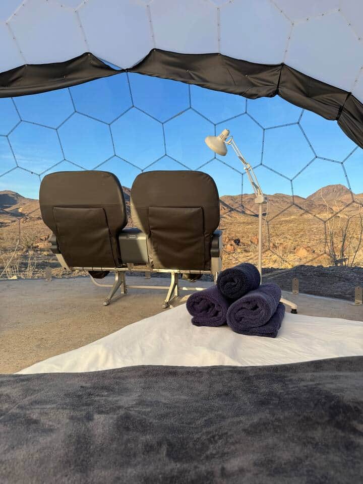 Lounge seating with sunset views at Space Pod 012