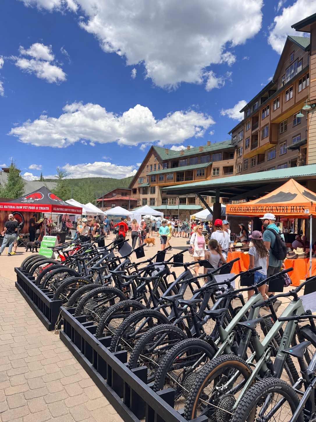 Parked bicycles and market tents in the Winter Park Resort village