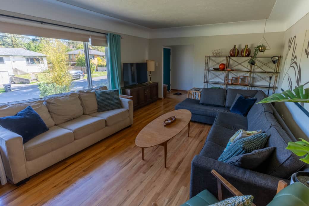 Enjoy the timeless style of this mid-century modern, complete with vintage record player & sofa bed.