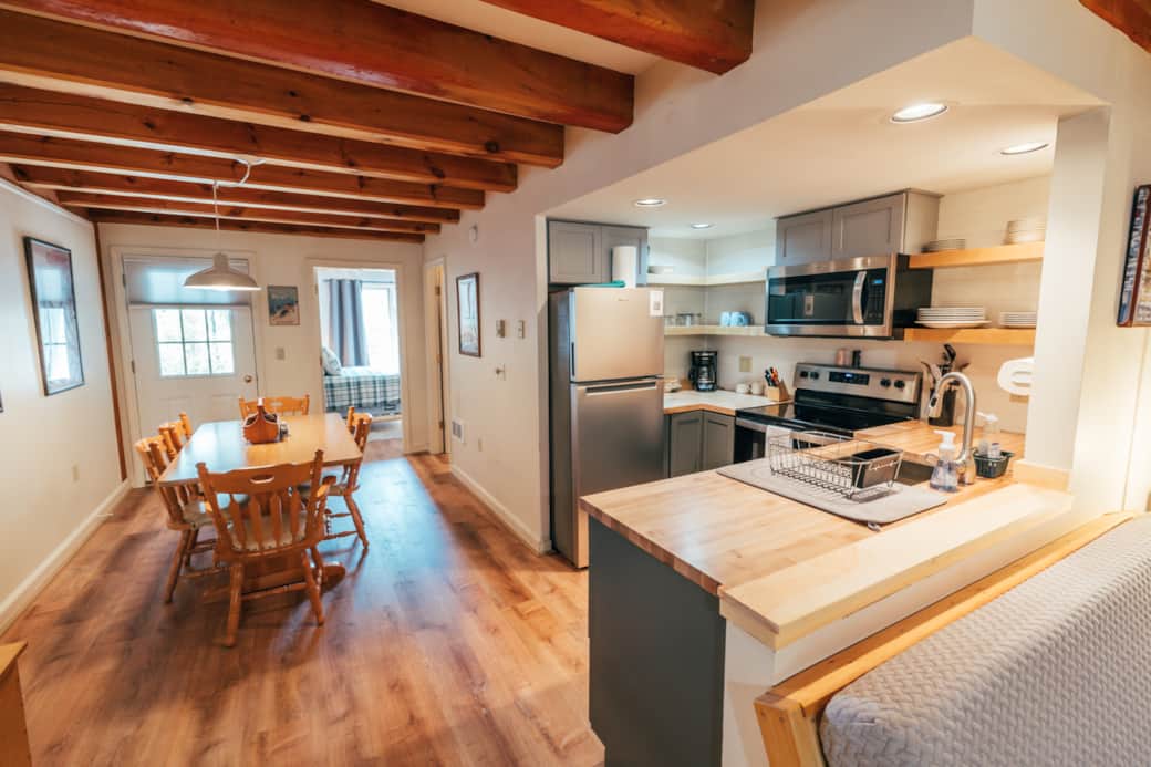 Open concept living area, kitchen and dining.