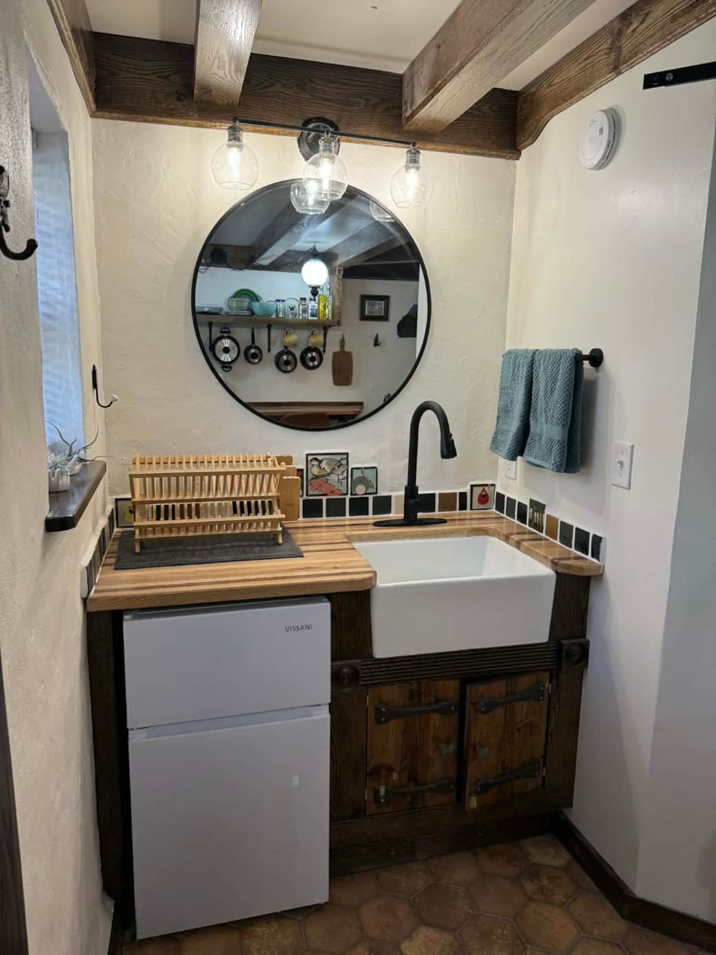 Sink area with mini fridge Sink area with mini fridge