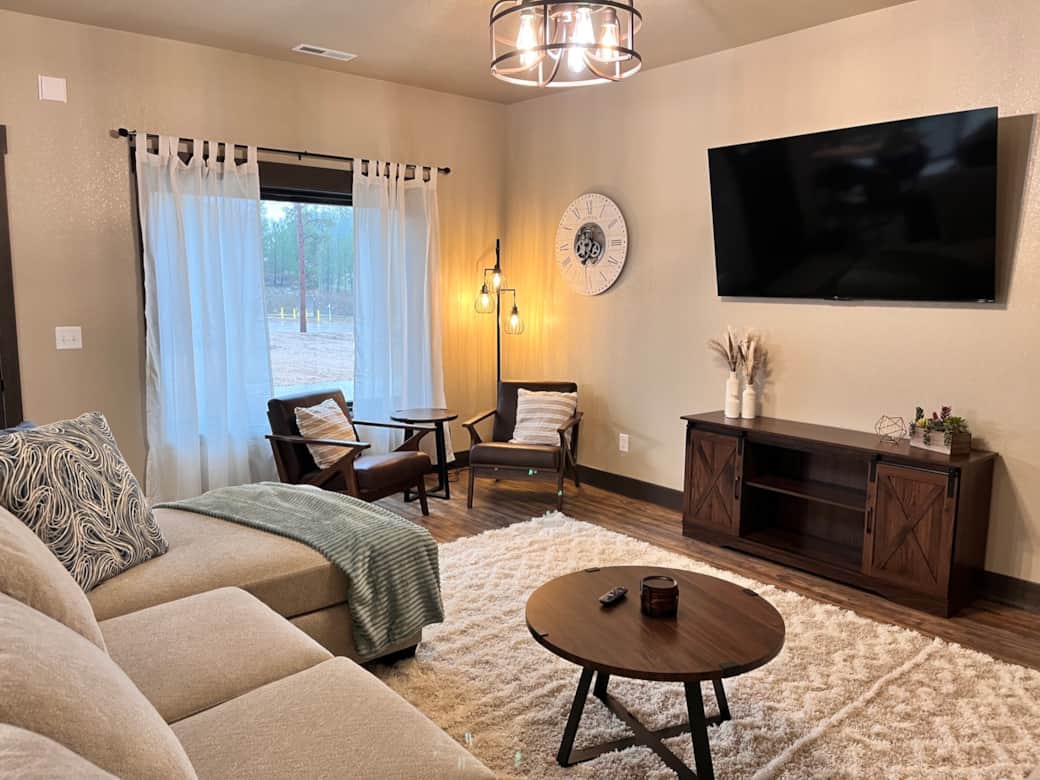 Cuddle up on our soft velvety sofa and watch the sunrise through the pines. 