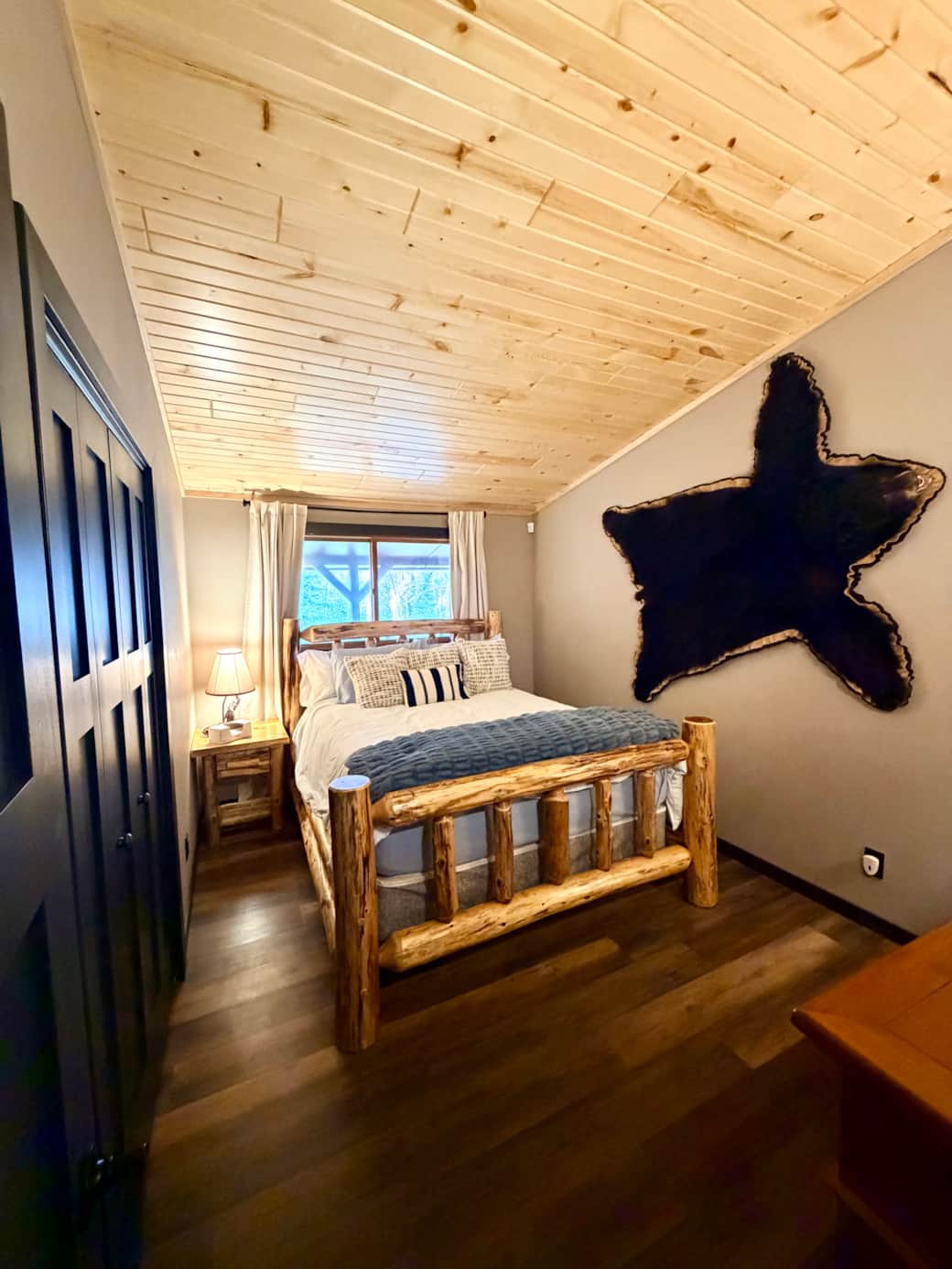 Queen Bedroom with new knotty pine ceiling installed