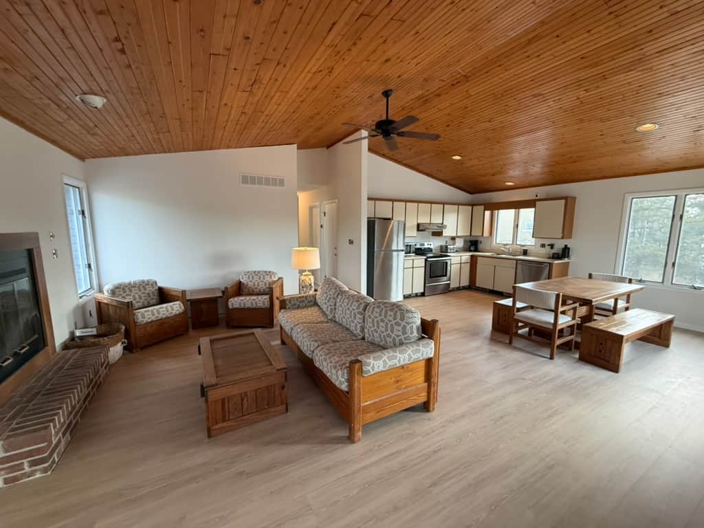 The Great Room combining the kitchen & living room. A 70" being installed above the fireplace. 