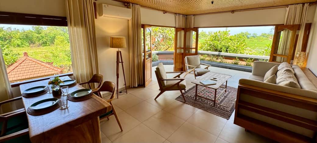 Open plan living and dining room with wrap around balcony