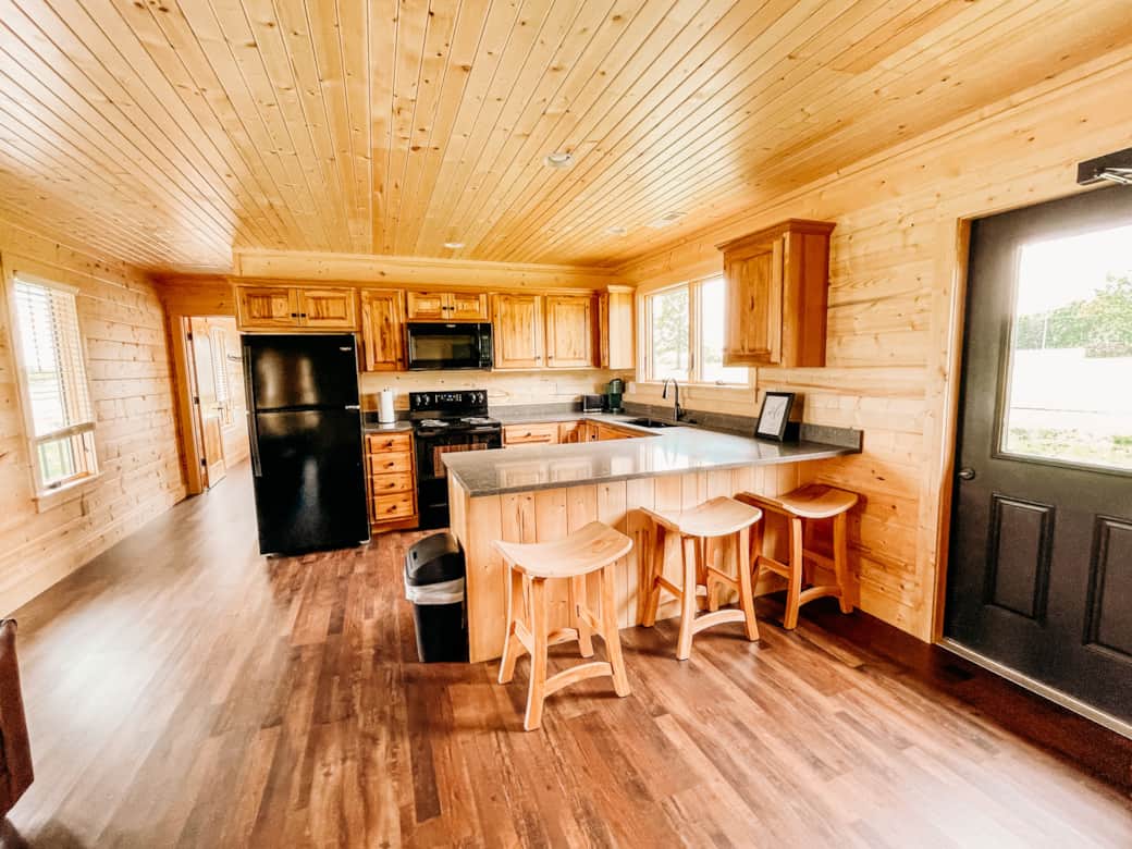 Full kitchen and living area in The Bear Cabin