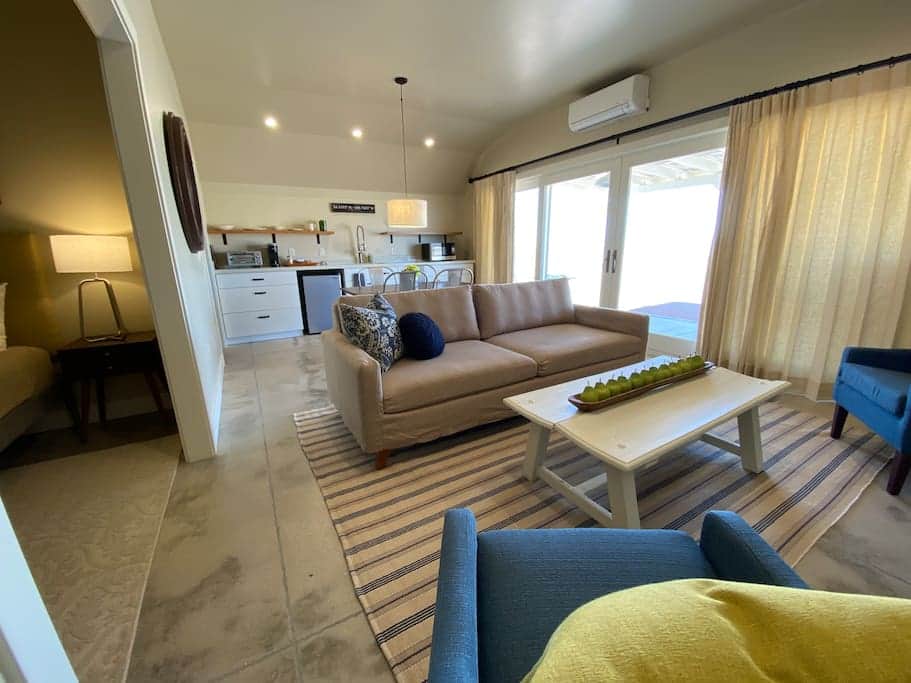 Living room and kitchenette in the suite side of the hut.