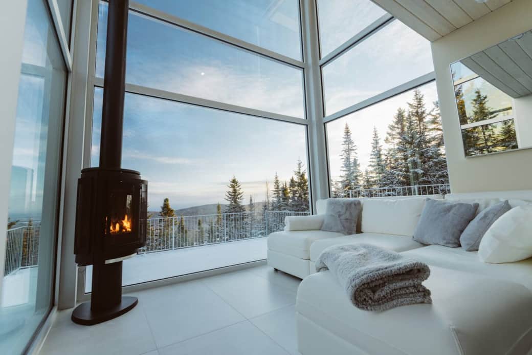 The living room offers full size windows on 3 sides for a truly immersive experience in nature.