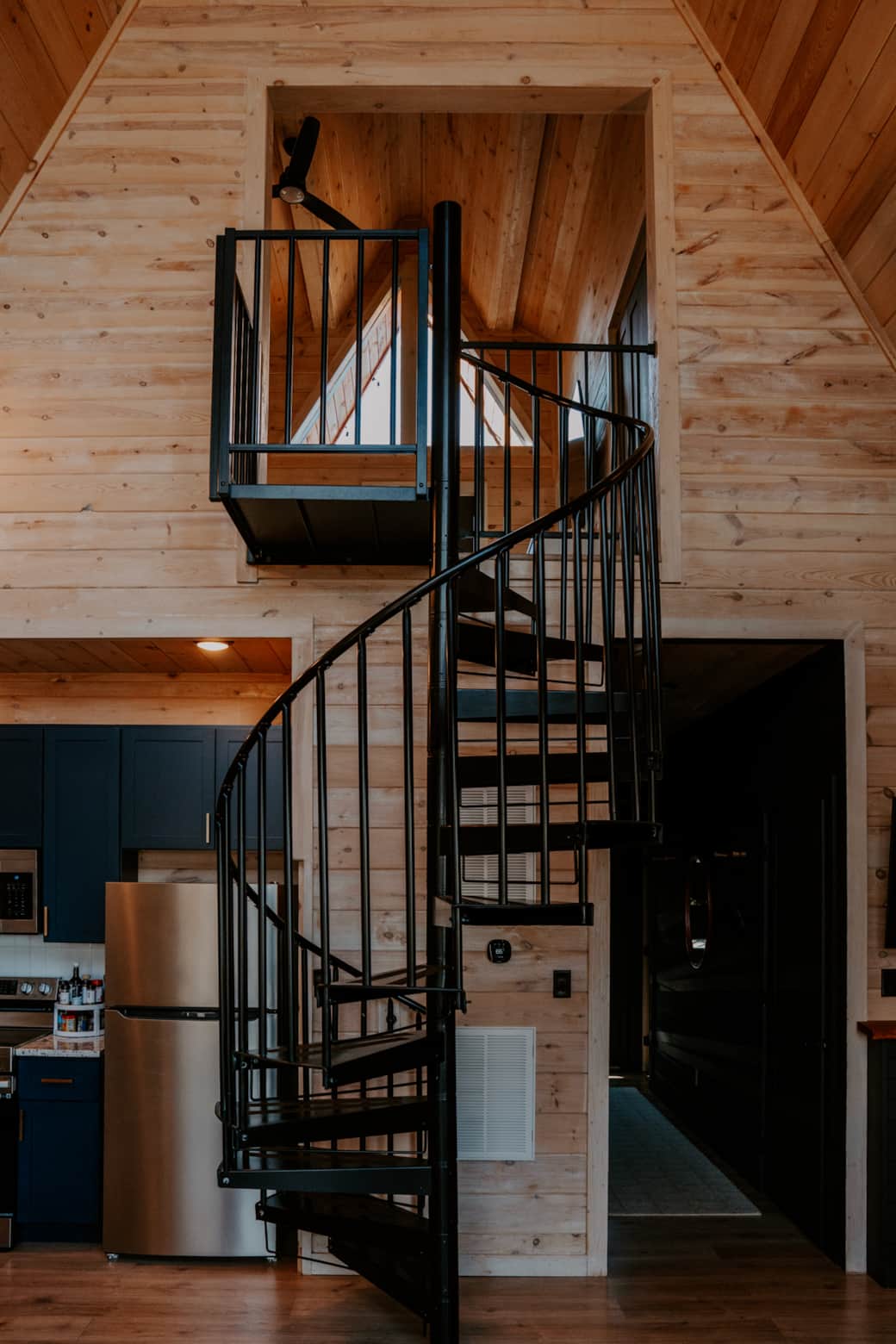 Spiral stairs to the upstairs master bedroom and private balcony Spiral stairs to the upstairs master bedroom and private balcony