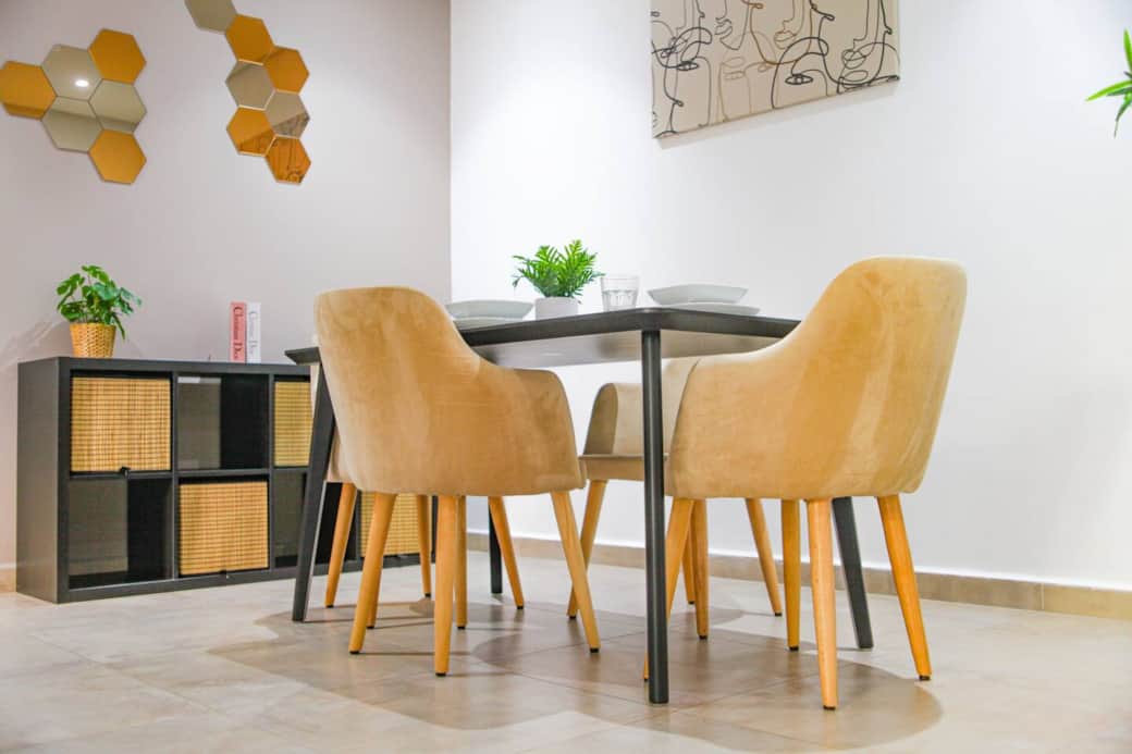 The dining table can easily accommodate the whole group for a gourmet meal.