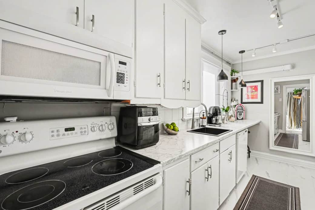 Fully equipped kitchen with updated appliances and stone countertops