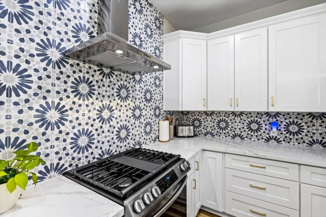 Fire extinguisher and cleaning supplies under the sink. 