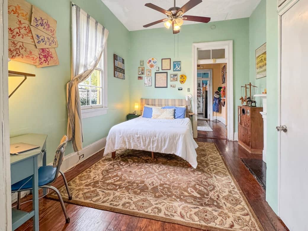 Queen bed, desk, and storage in bedroom 1