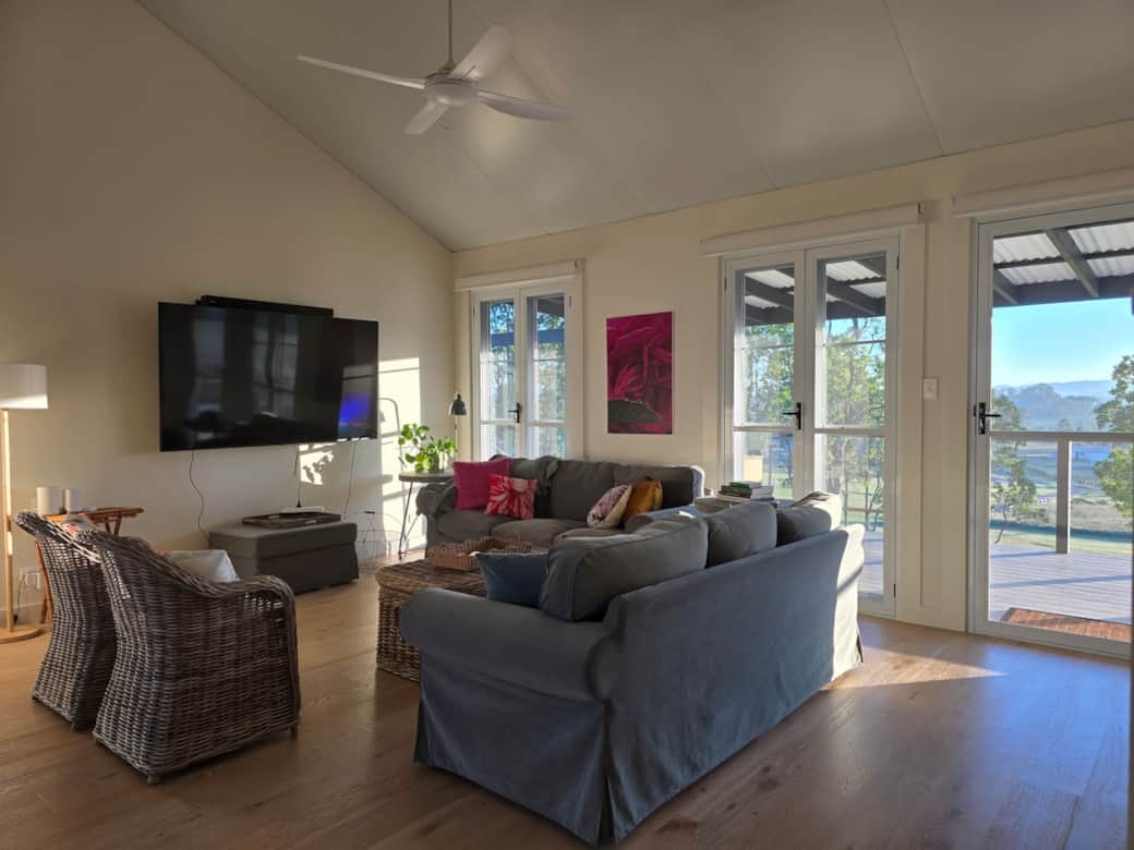 Living room with a 4 seater dining table and kitchenette. Living room with a 4 seater dining table and kitchenette.