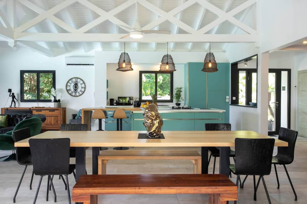 Dining room opening onto the kitchen and living room Saba