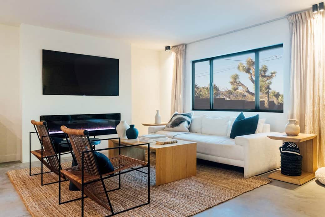 Living is a comfortable space with turntable, flatscreen smart TV, electric fireplace and views out towards the front yard and backyard. Living is a comfortable space with turntable, flatscreen smart TV, electric fireplace and views out towards the front yard and backyard.