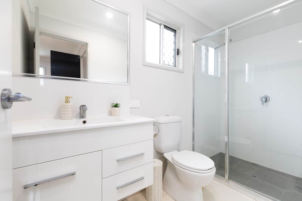 Bathroom: Stylish bathroom with walk-in shower, vanity, and clean finishes 