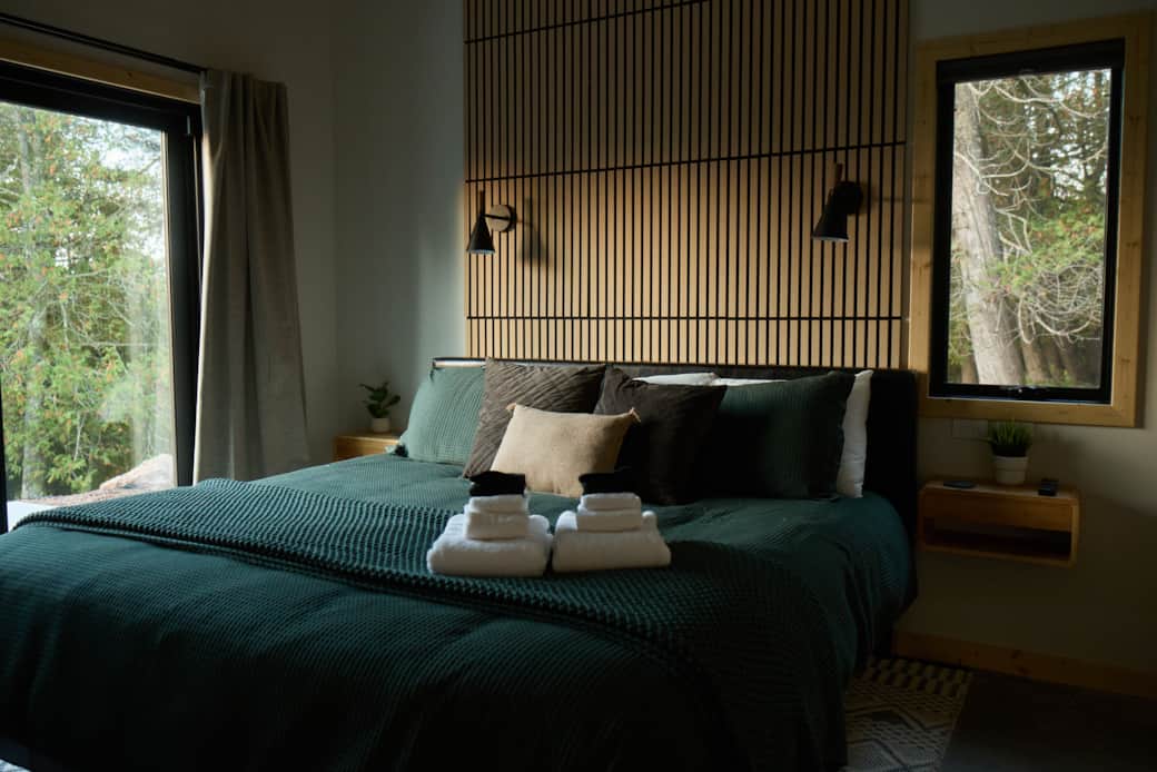 Main Bedroom: King Bed with Lake Superior + Forest Views