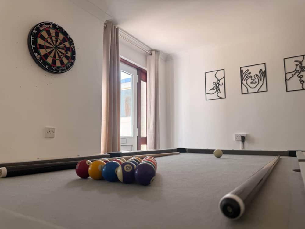 Games room with a pool table and dartboard in a Haven Homes house
