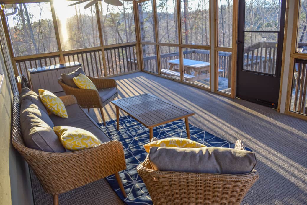 Screened porch surrounded by nature