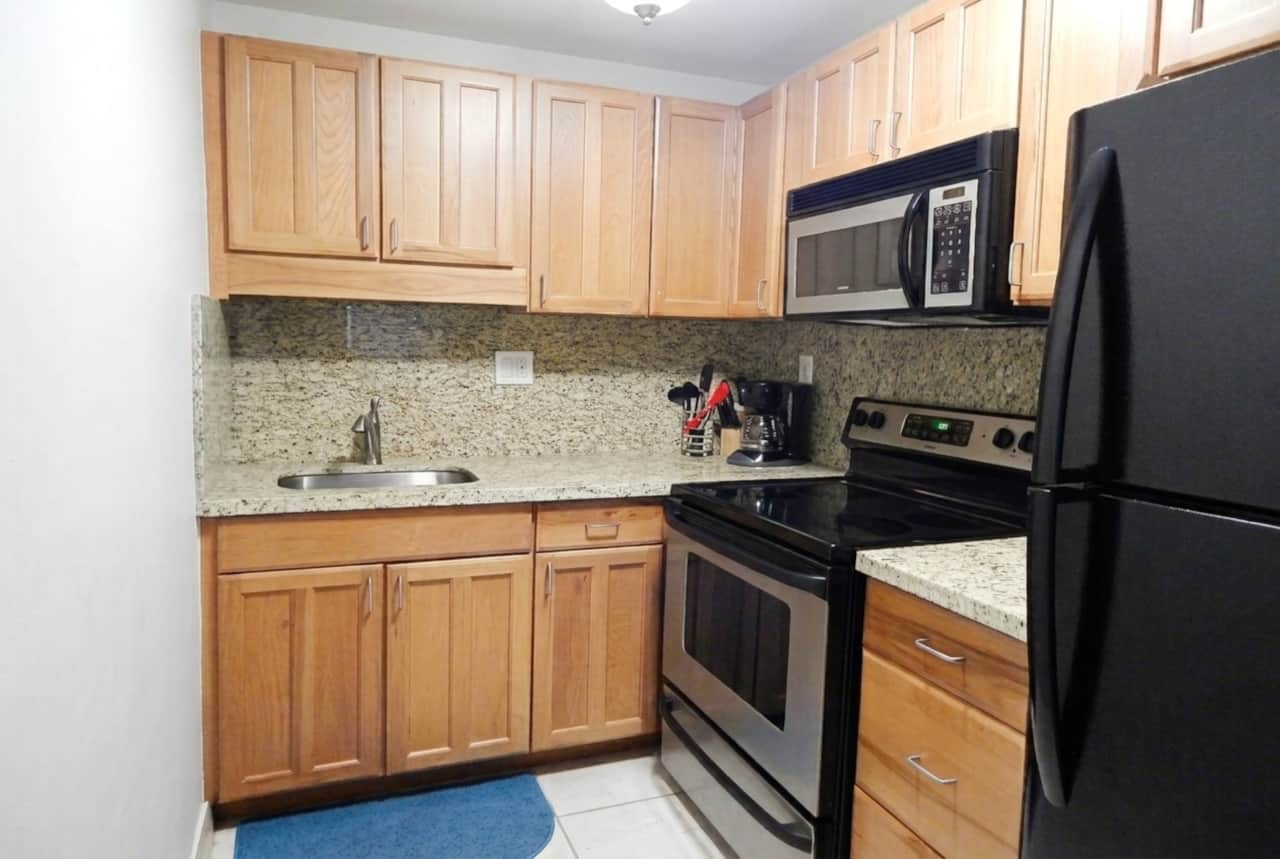 Unit #11 - Granite Countertops & Full Size Appliances. Stocked with everything you need