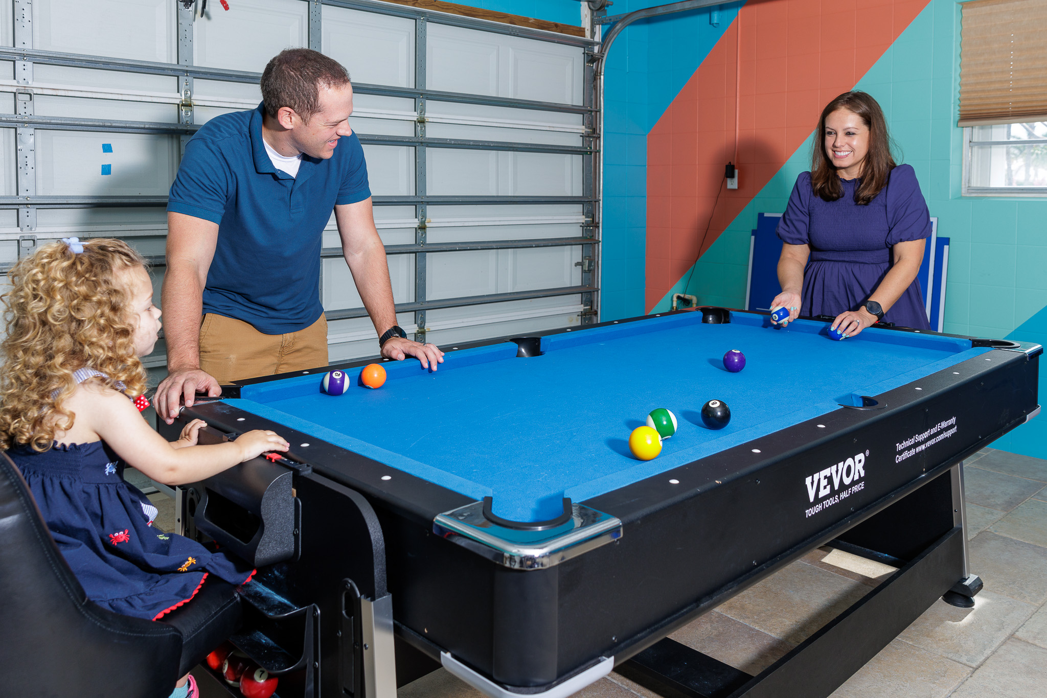 Family fun starts in the colorful game room with a full-size pool table.