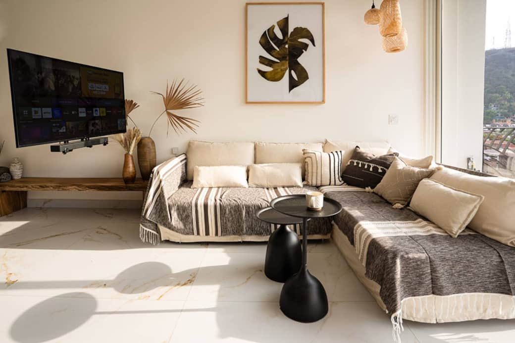 L-shaped sofa with a 55" smart TV on swivel mount L-shaped sofa with a 55" smart TV on swivel mount