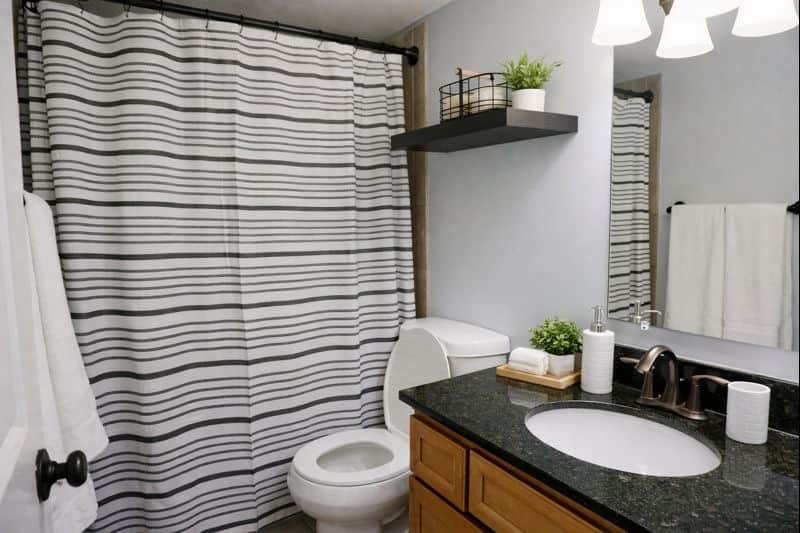Bright, minimalist bathroom featuring a  tub and all the essentials thoughtfully stocked.