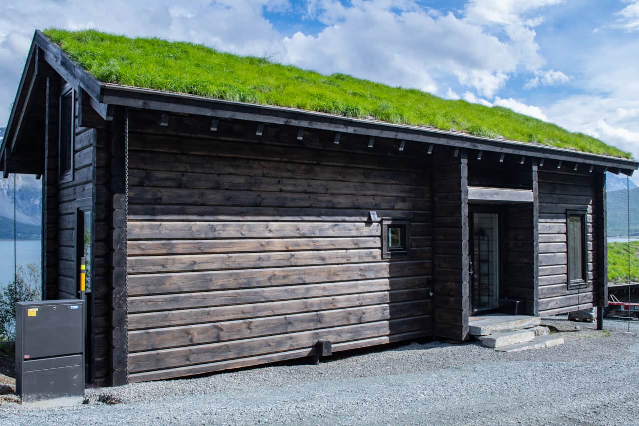 Bjørka on the Ulsfjord. Timber, Lyngen Alps beyond. Book direct, three nights minimum.