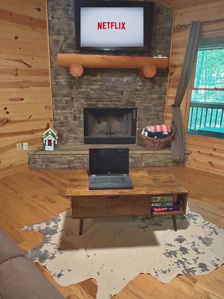 Coffee table opens for dining, work or to access board games