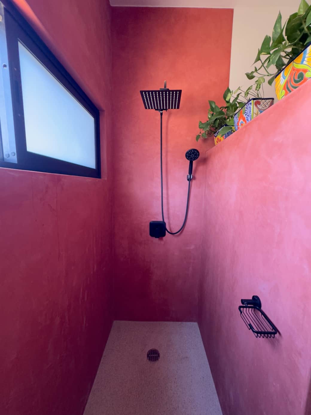 Striking red rain shower with a convenient handheld option Striking red rain shower with a convenient handheld option