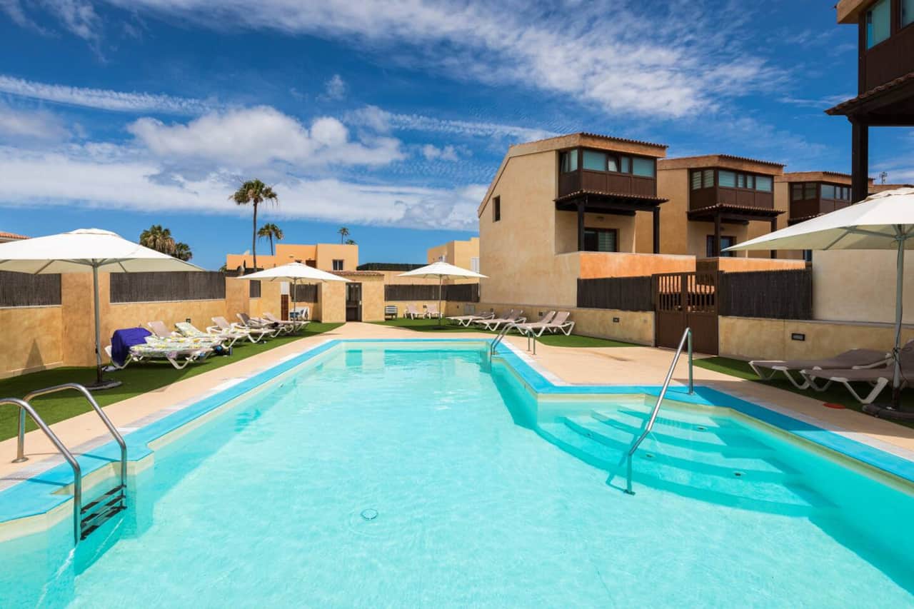 Communal Pool with comfortable sun loungers 25m from Villa